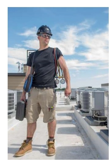 hvac specialist standing on the roof